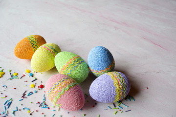 Easter eggs on a table. Beautiful easter background. Homemade holiday decor.	