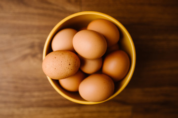 Farm Fresh Brown Eggs in a Yellow Bowl