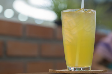 Close up of glass of iced japanese green tea in resturant.