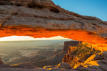 Beautiful Canyonlands view, from Mesa Arch, under warm surise light, on a clear autumn day