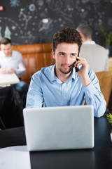 Young businessman in a cafe