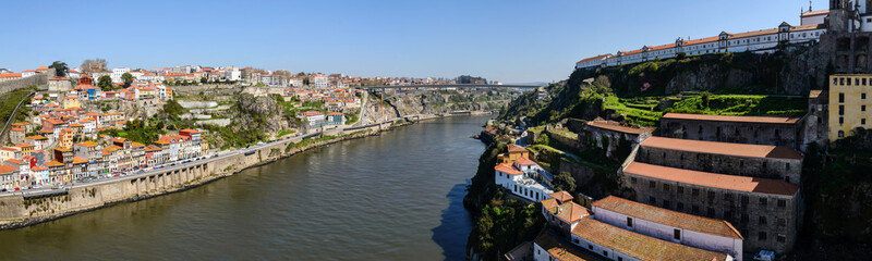 Panoramic image of the Douro River in Porto, Portugal. The image was made on the Dom Luis Bridge.  The Douro River separates the cities Porto and Vila Nova de Gaia.