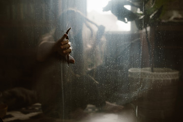 Woman Alone and Scared Hiding Behind a Tanslucent Screen