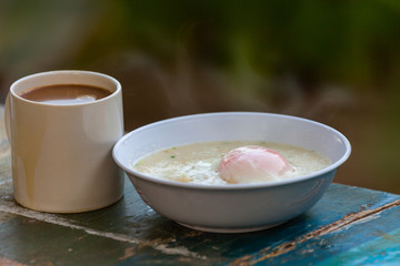 easy fast food cooking a simple egg porridge and hot coffee for breakfast