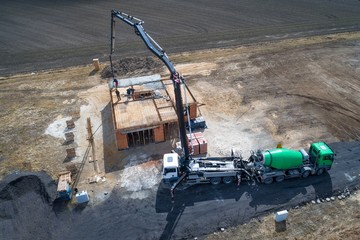 Pouring concrete from a concrete mixer