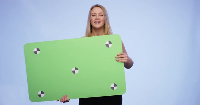 Hands are giving an oversized blank Card to a cheerful young lady