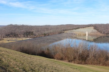 Fototapeta na wymiar The lake dam in the park on a sunny morning. 