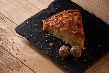 Delicious fresh baked piece of apple pie on shale board
