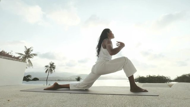 Woman practising yoga pose Parshva Upavistha Konasana. Healthy lifestyle concept