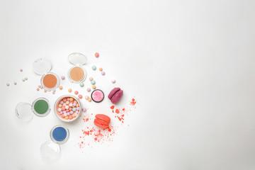 Decorative makeup products on white background
