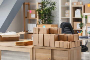 Parcels ready for shipment to client on table in home office