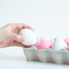 Woman's hand holding Easter egg. Easter composition