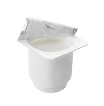 Plastic cup with yummy yogurt on white background