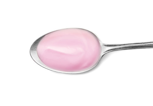 Spoon with yummy yogurt on white background