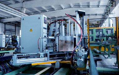 Factory for aluminum and PVC windows and doors production. Details industrial equipment.