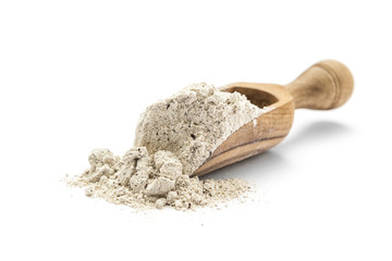 Buckwheat flour in scoop on white background