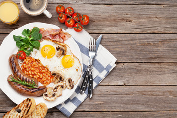 English breakfast. Fried eggs, sausages, bacon