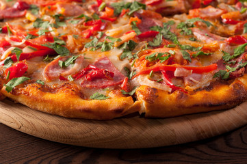 Pizza on a wooden board, close-up