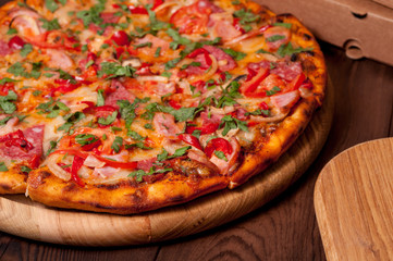 Pizza on a wooden board, close-up