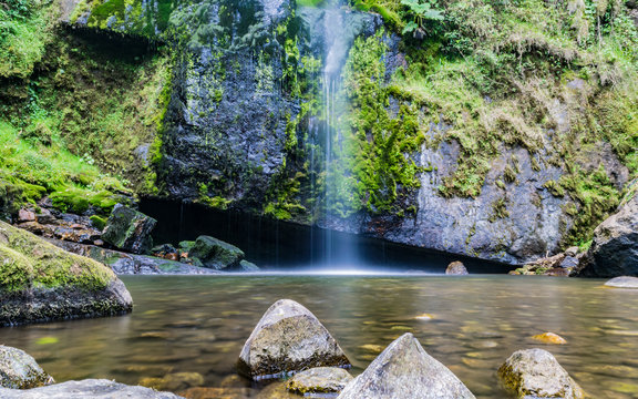 Long exposure of crystal clear water flowing down, landscape view