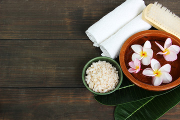 Spa setting on wooden table.