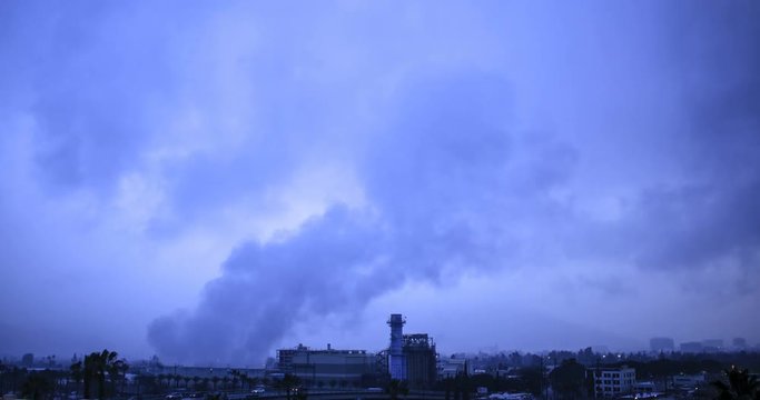 4k Clip of Smoke Stacks in Smoggy City