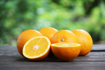 Oranges fruit on wooden table.