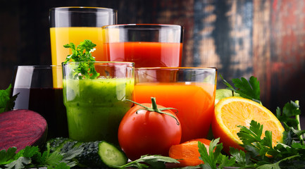 Glasses with fresh organic vegetable and fruit juices