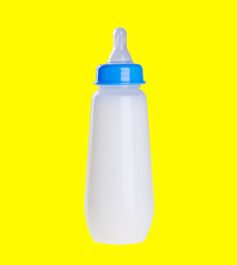 Baby bottle with milk on background