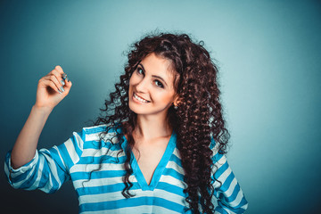 woman writing holding pen smiling happy