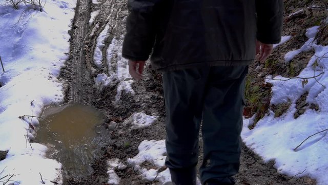 Man goes into the puddle mirror - (4K)