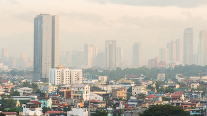 Fototapeta na wymiar Panorama of the City of Manila with skyscrapers early in the morning.