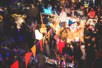 Christmas Market Interior with New Year decorations and multicolored flags