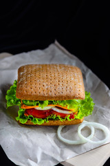 Sandwich with grain bread on a black background