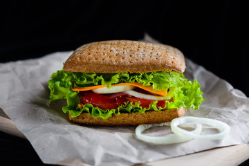 Sandwich with grain bread on a black background