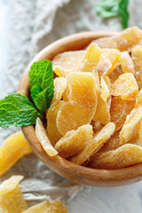 Slices of spicy ginger in sugar.