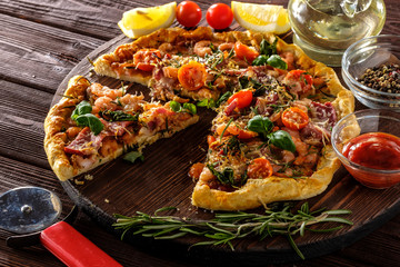 Delicious homemade fresh pizza with shrimps and bacon