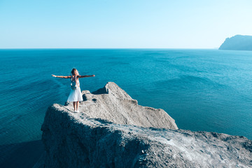 Girl standing on the mountain top