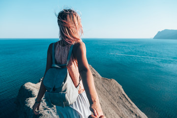 Girl standing on the mountain top