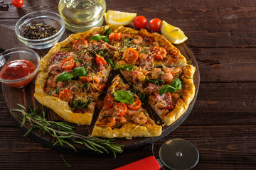 Delicious homemade fresh pizza with shrimps and bacon