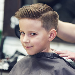 Smiling European boy in a barber shop. Ready look. - 198239995