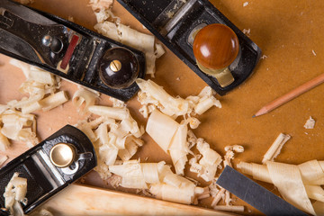 carpenter tools in pine wood table top view