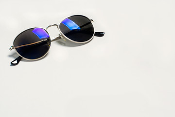 Too stylish fashionable sunglasses isolated on a light grey background. The concept of sun, summer,...