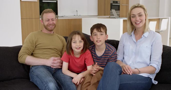 Young family have skype conversation in contemporary moern home