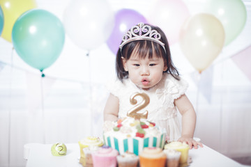 Obraz na płótnie Canvas Baby girl celebrate her second birthday