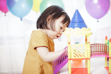 baby girl play toy at home
