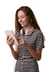 Fototapeta premium Photo of a young cheerful girl, isolated on white background. Looking at the camera showing the display of the tablet computer.