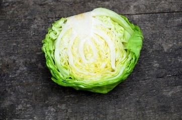 
Cut cabbage cabbage on a wooden surface.