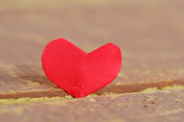 Fototapeta premium Valentines day red heart on old wood. Holidays card
