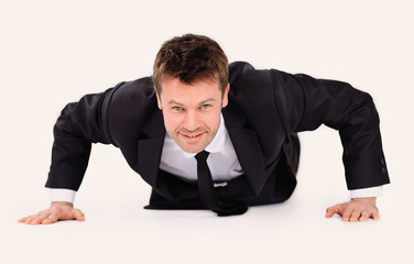 young businessman being wrung out from a floor